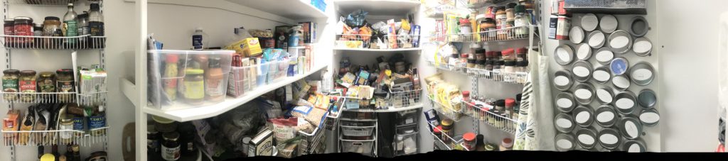 Panoramic photo of the messy and overflowing pantry
